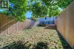 Fenced backyard with a wooden deck - 