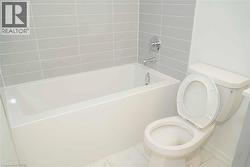 Full bathroom featuring toilet and tub / shower combination - 