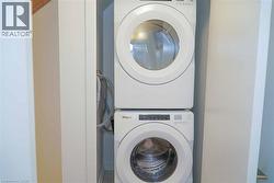 Laundry room featuring stacked washer / drying machine - 