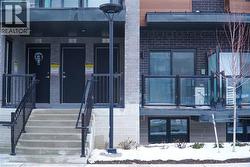 View of exterior entry featuring brick siding - 