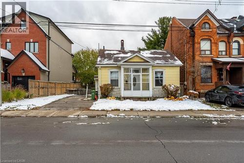 Traditional-style house featuring stone siding - 193 Locke Street N, Hamilton, ON - Outdoor With Facade
