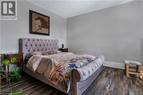 Bedroom featuring dark wood-type flooring - 193 Locke Street N, Hamilton, ON - Indoor Photo Showing Bedroom