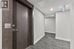 Corridor with attic access and carpet flooring - 