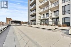 View of property's community with a patio area - 