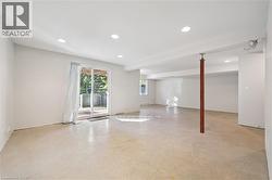 Unfurnished room with recessed lighting, concrete floors, and beamed ceiling - 