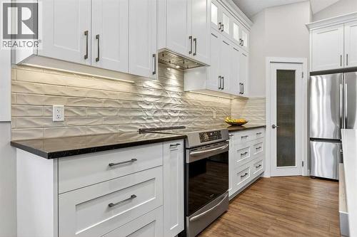 Stainless steel appliances included - 509 Riverview Place Se, Calgary, AB - Indoor Photo Showing Kitchen With Upgraded Kitchen