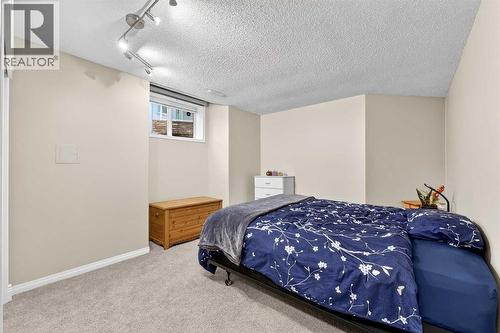 Bedroom four (one of tw in the basement) - 509 Riverview Place Se, Calgary, AB - Indoor Photo Showing Bedroom