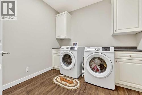 Large laundry room which includes a laundry chute - 509 Riverview Place Se, Calgary, AB - Indoor Photo Showing Laundry Room