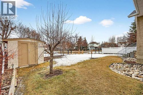 Peaceful backyard with path and greenbelt in behind. Yes, the shed is included - 509 Riverview Place Se, Calgary, AB - Outdoor
