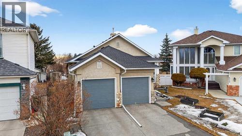 Double car garage with duo-doors 8'9(w)x8'0(h), so yes, your SUV should fit - 509 Riverview Place Se, Calgary, AB - Outdoor With Facade