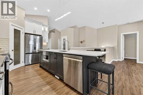 Room for stools at the island - 509 Riverview Place Se, Calgary, AB - Indoor Photo Showing Kitchen With Upgraded Kitchen