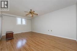 Spare room featuring light wood-style floors and ceiling fan - 