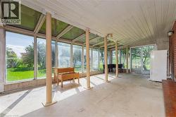 Sunroom / solarium with unfinished concrete floors - 