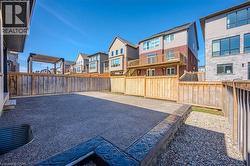 Fenced backyard with a residential view and a patio - 