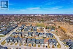 Aerial view of property's location with nearby suburban area - 