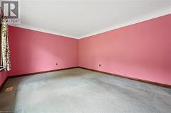 Spare room with carpet floors and baseboards - 