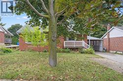 View of green lawn with a sunroom - 