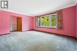 Spare room with baseboards and carpet floors - 