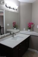 Bathroom featuring vanity and light tile patterned floors - 