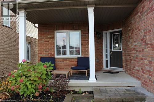 View of exterior entry with a porch and brick siding - 561 Thomas Slee Drive, Kitchener, ON - Outdoor With Exterior