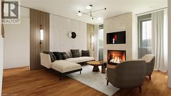 Living room with a large fireplace, wood finished floors, and a chandelier - 