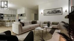 Living area with light wood-style flooring and recessed lighting - 