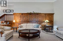 Living room with carpet and baseboards - 