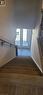 Stairs with french doors and wood finished floors - 17 Renfrew Trail, Welland, ON  - Indoor Photo Showing Other Room 