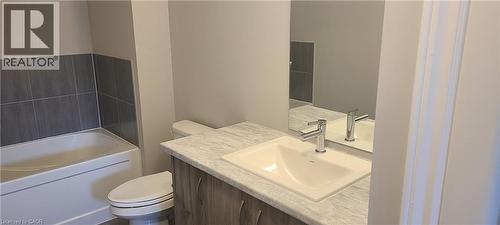 Bathroom featuring toilet, a bathtub, and vanity - 17 Renfrew Trail, Welland, ON - Indoor Photo Showing Bathroom