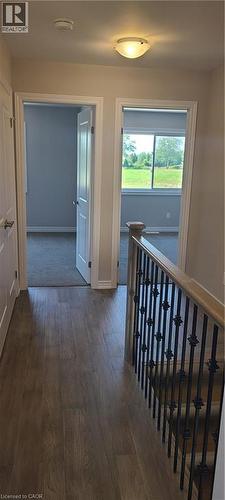 Hallway featuring dark wood-style flooring and baseboards - 17 Renfrew Trail, Welland, ON - Indoor Photo Showing Other Room