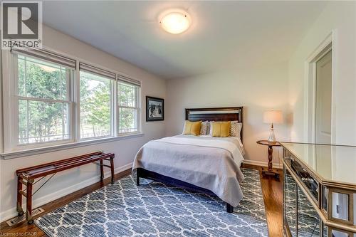 Bedroom with baseboards, wood finished floors, and visible vents - 4306 Lakeshore Road, Burlington, ON - Indoor Photo Showing Bedroom