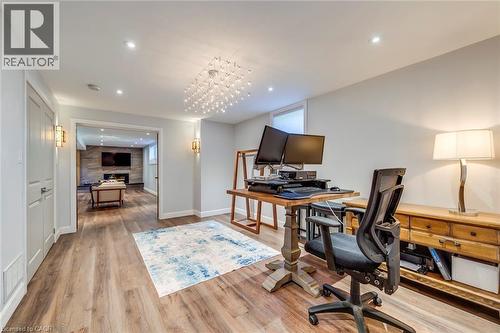 Office space with recessed lighting, baseboards, wood finished floors, and a high end fireplace - 4306 Lakeshore Road, Burlington, ON - Indoor Photo Showing Office