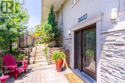 Property entrance with fence and a patio area - 