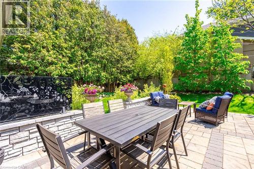 View of patio featuring a fenced backyard, outdoor dining space, and outdoor lounge area - 4306 Lakeshore Road, Burlington, ON - Outdoor With Deck Patio Veranda