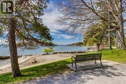 View of home's community featuring a lawn and a water view - 