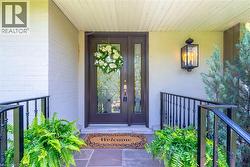 Doorway to property with covered porch - 
