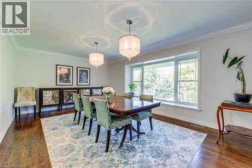 Dining space with visible vents, ornamental molding, baseboards, and wood finished floors - 4306 Lakeshore Road, Burlington, ON - Indoor Photo Showing Dining Room