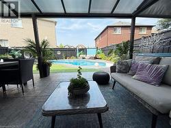 View of swimming pool with outdoor lounge area, a fenced backyard, and a patio area - 