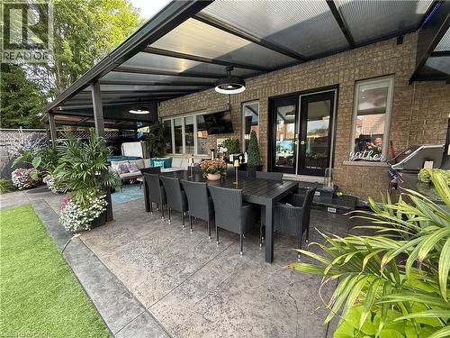 View of patio with an outdoor hangout area, outdoor dining area, french doors, and area for grilling - 11 Donatello Court, Hamilton, ON - Outdoor With Deck Patio Veranda