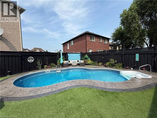 View of swimming pool with an outdoor living space and a fenced backyard - 11 Donatello Court, Hamilton, ON - Outdoor With In Ground Pool With Deck Patio Veranda With Backyard