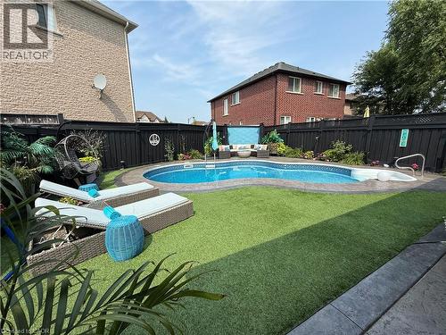 View of pool with a fenced backyard and a patio - 11 Donatello Court, Hamilton, ON - Outdoor With In Ground Pool With Deck Patio Veranda With Backyard