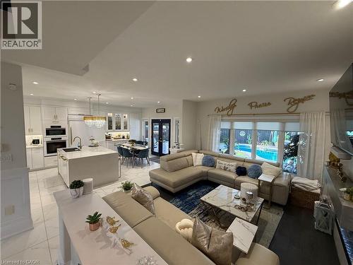 Living room with recessed lighting and french doors - 11 Donatello Court, Hamilton, ON - Indoor Photo Showing Living Room