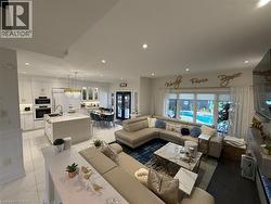 Living room with recessed lighting and french doors - 