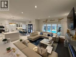 Living room featuring recessed lighting and french doors - 