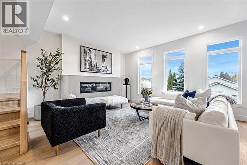 83 Dunnigan Drive, Kitchener, ON - Indoor Photo Showing Living Room With Fireplace
