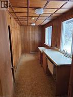 Laundry & storage room (LOTS of closet & cupboard space!). Trapdoor to furnace & crawl-space at far end. - 