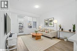 Living room featuring light wood-type flooring - 
