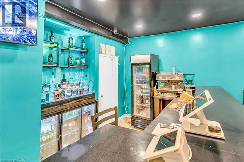 Miscellaneous room featuring a bar, recessed lighting, and tile patterned floors - 612 King Street E, Kitchener, ON 