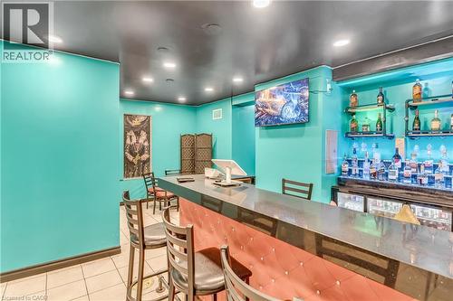 Indoor dry bar featuring light tile patterned floors, recessed lighting, and electric panel - 612 King Street E, Kitchener, ON 