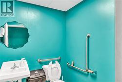 Half bath with a drop ceiling and toilet - 